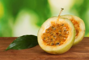 green passion fruit on bright green background close-up